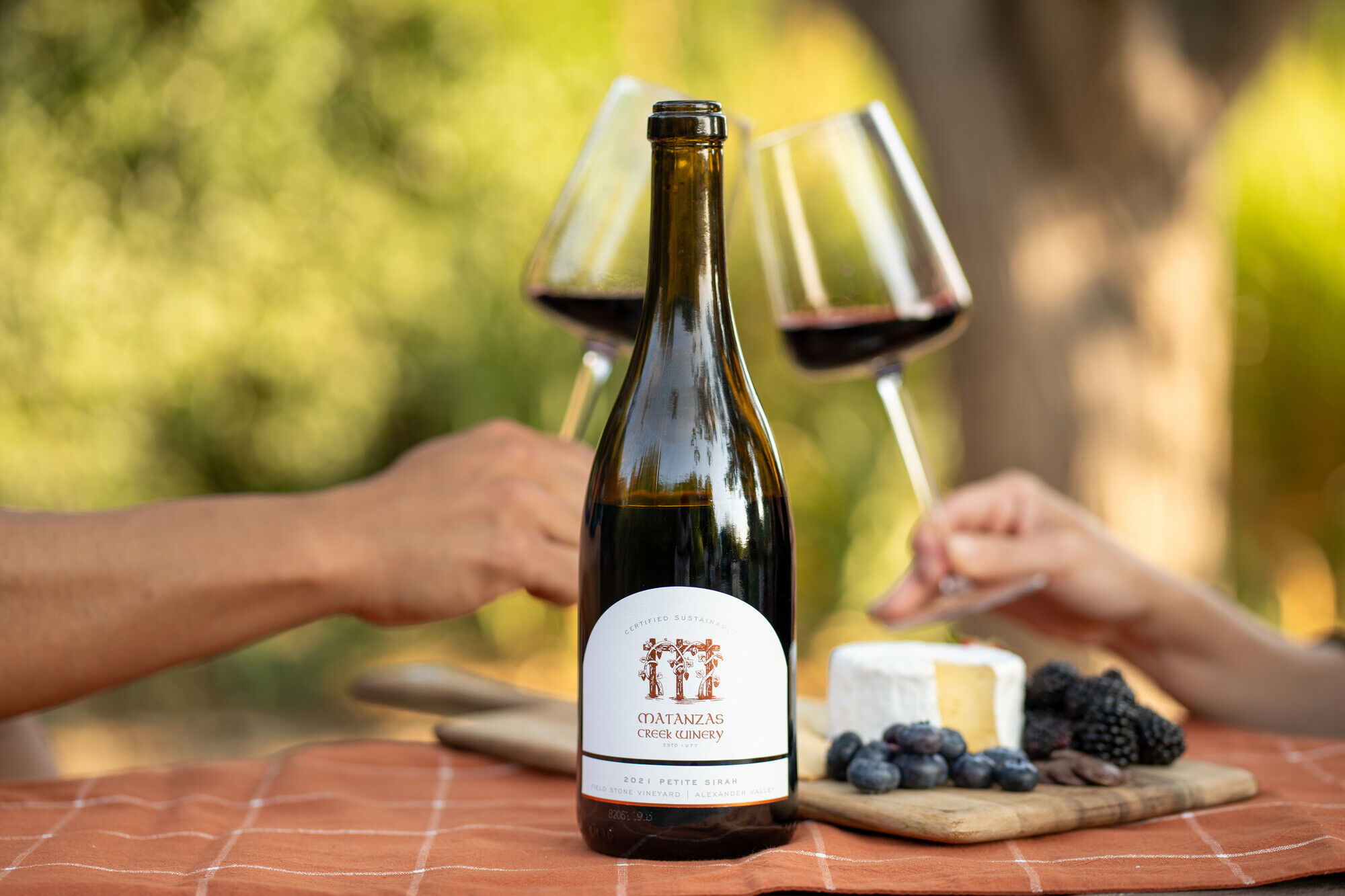 A bottle of Matanzas Creek Petit Sirah with a charcuterie board